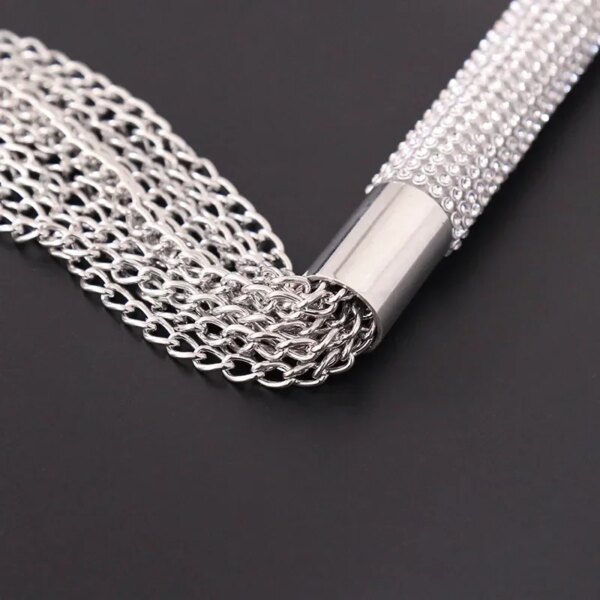 Adult Whip with Diamond Handle Heavy Chain BDSM Flogger on satin bedspread – elegant sensual accessory