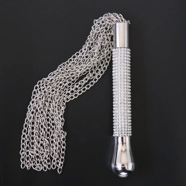 Adult Whip with Diamond Handle Heavy Chain BDSM Flogger on satin bedspread – elegant sensual accessory