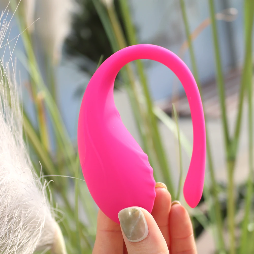 Pink wearable vibrating egg massager with a sleek wireless remote control.