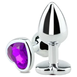A sleek, silver-toned metal anal plug with a tapered tip and a brilliant clear crystal diamond embedded in the circular base.
