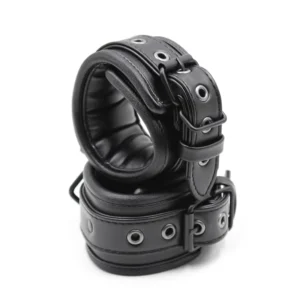 Pair of black soft leather handcuffs with silver metal hang buckles and links