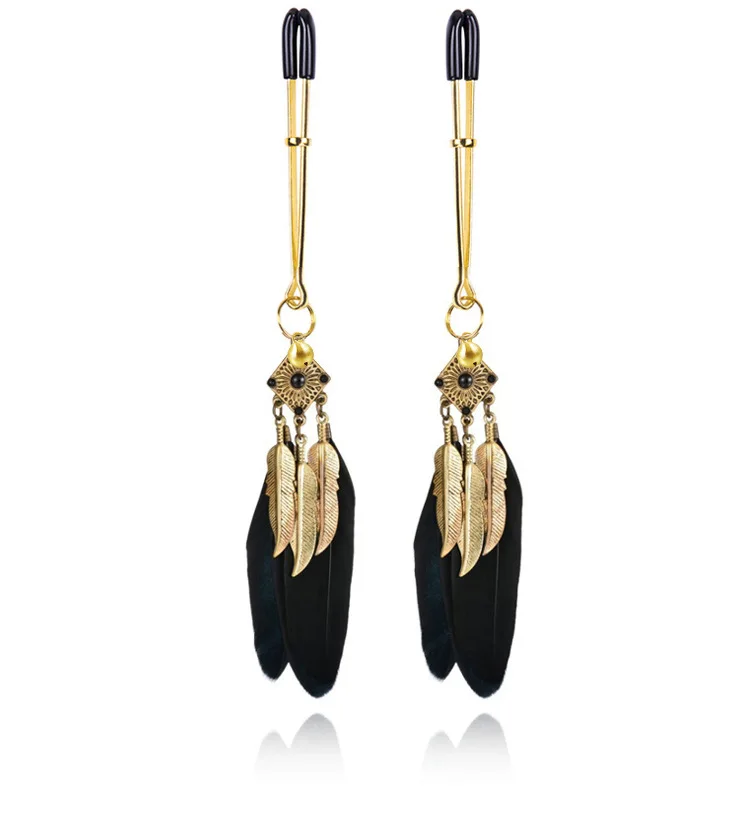 Pair of silver metal nipple clamps featuring white feather charms and small circular bells for sensory SM teasing play.