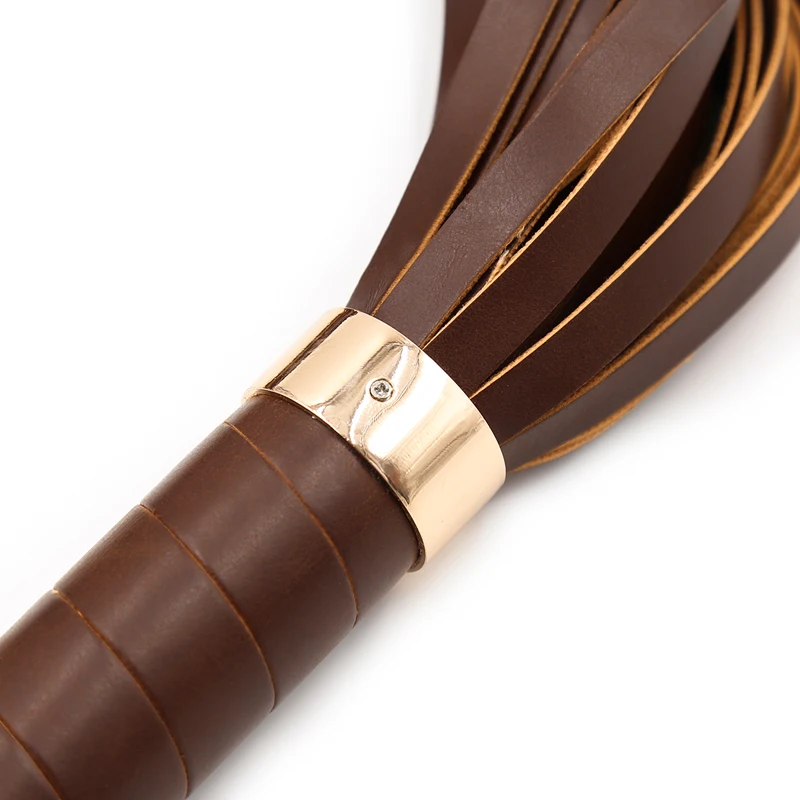 A black PU leather bondage flogger with long tassels and a textured handle for adult couples' games.