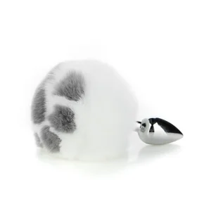 Metal anal plug with a fluffy white real rabbit fur tail and a decorative cat claw base on a clean background.