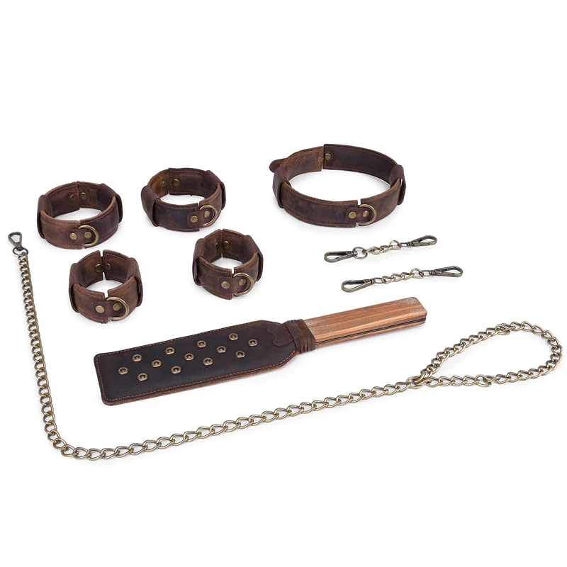 Four-piece brown vintage pull-up leather bondage set featuring handcuffs, ankle cuffs, collar, and a spanking paddle on a neutral background.
