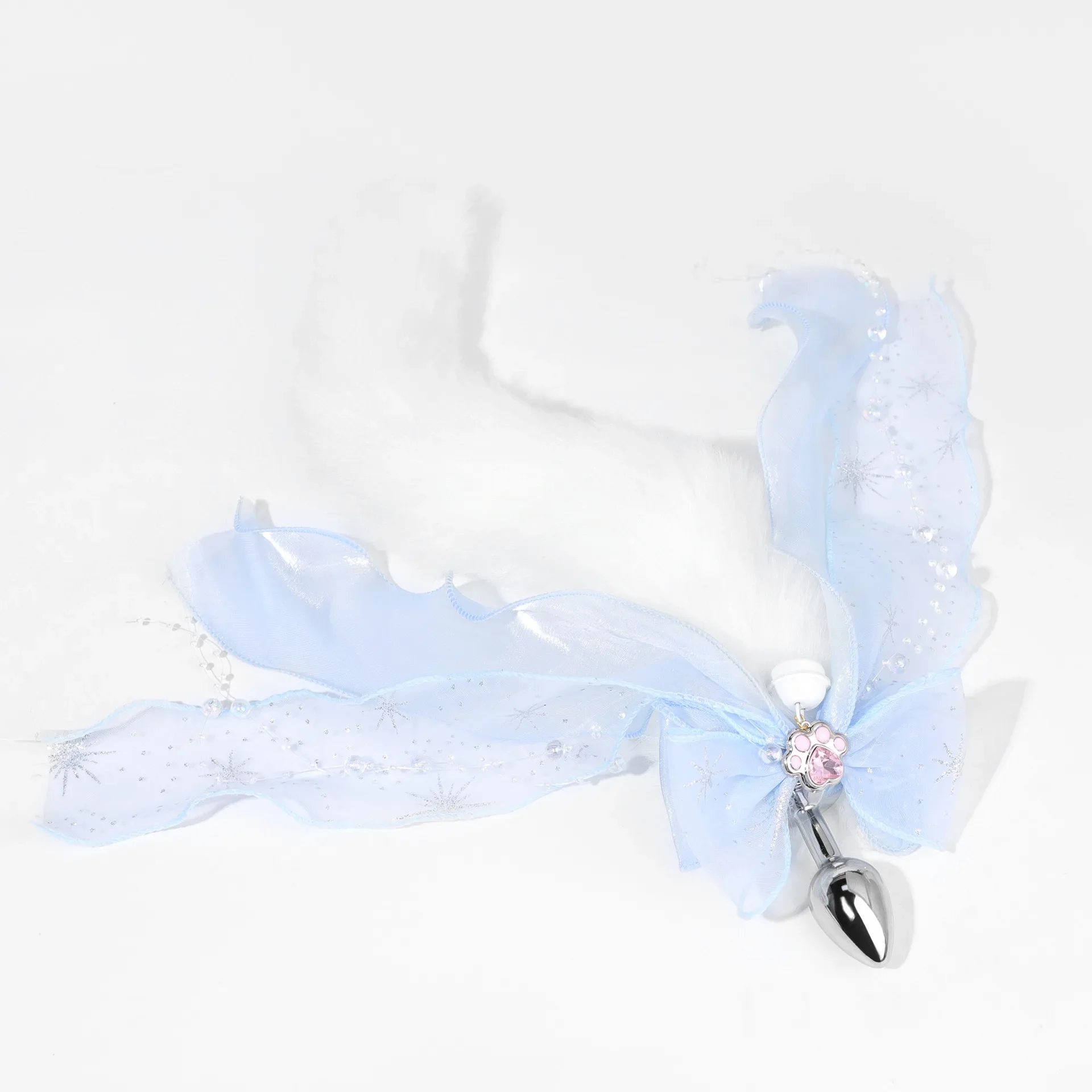A metal anal plug with a colorful, plush fox tail attachment for erotic adult games.