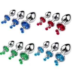 Three silver-toned metal anal plugs with heart-shaped bases and attached small bells.