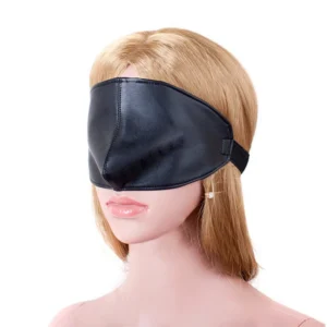 Close-up of a black PU leather sex eye mask with nose cover and large area design for sensory deprivation and BDSM play.
