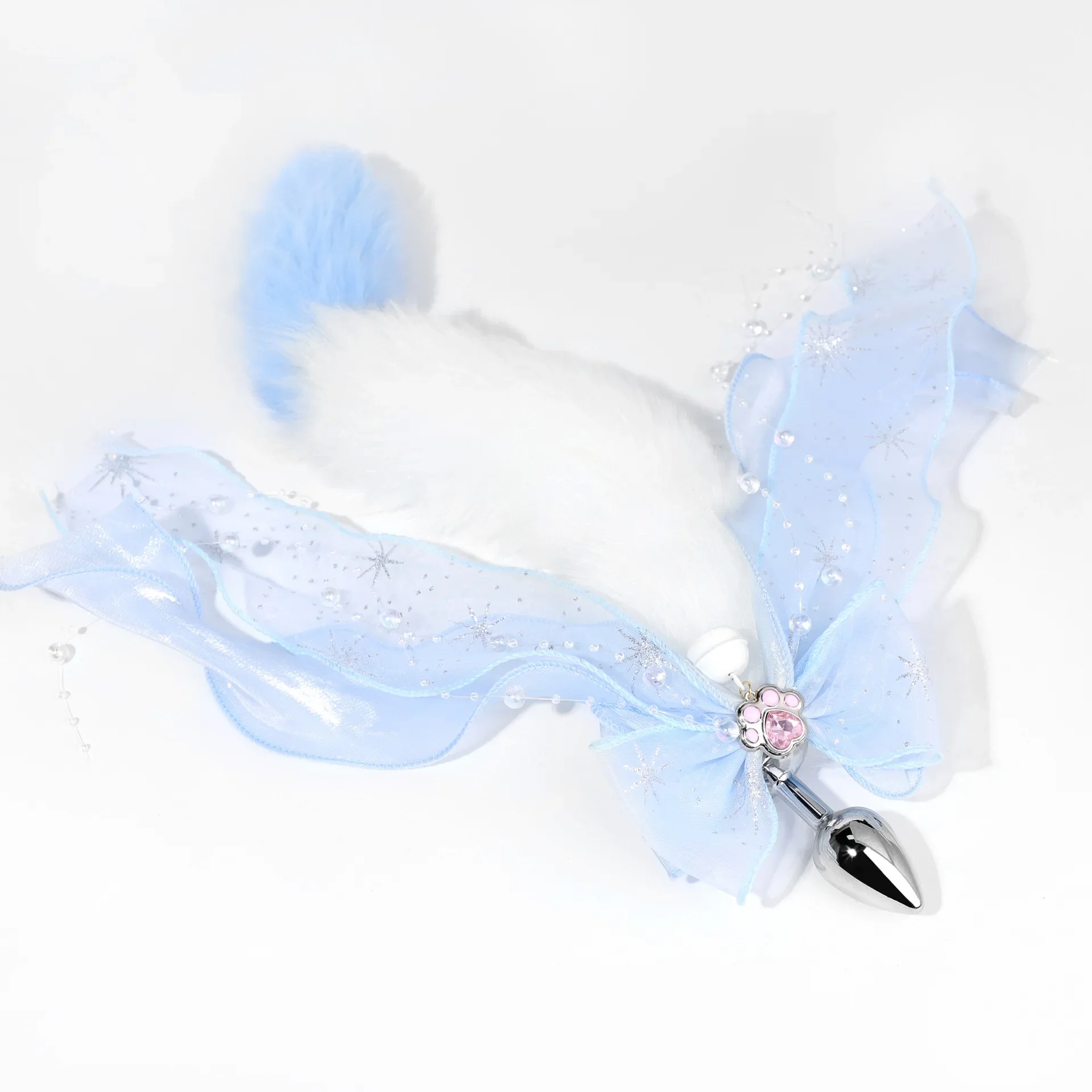 A metal anal plug with a colorful, plush fox tail attachment for erotic adult games.