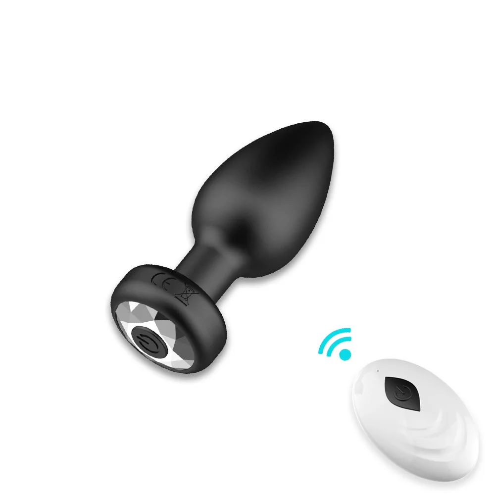 Black remote control anal plug vibrator with wireless transmitter and sleek ergonomic design.