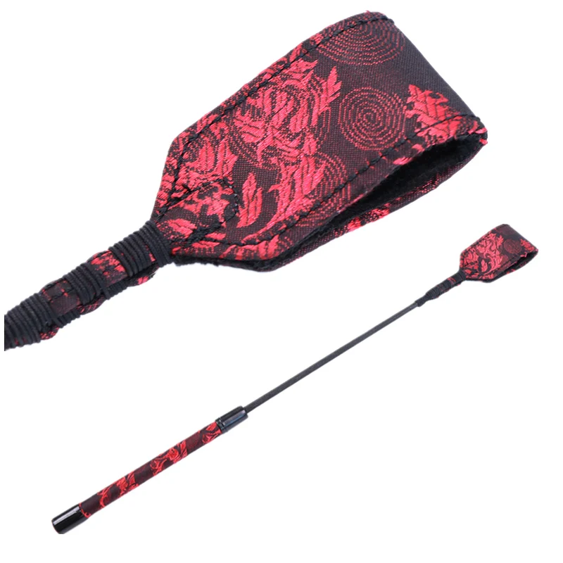 Red cloth pattern BDSM flogger and spanking rod for adult roleplay and fetish games.