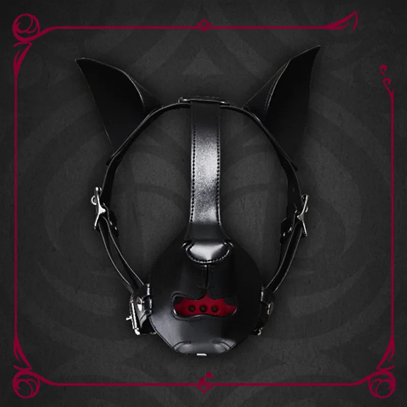Close-up of a high-end black K9 puppy play hood with adjustable straps and integrated mouth ball gag for bondage role-play.