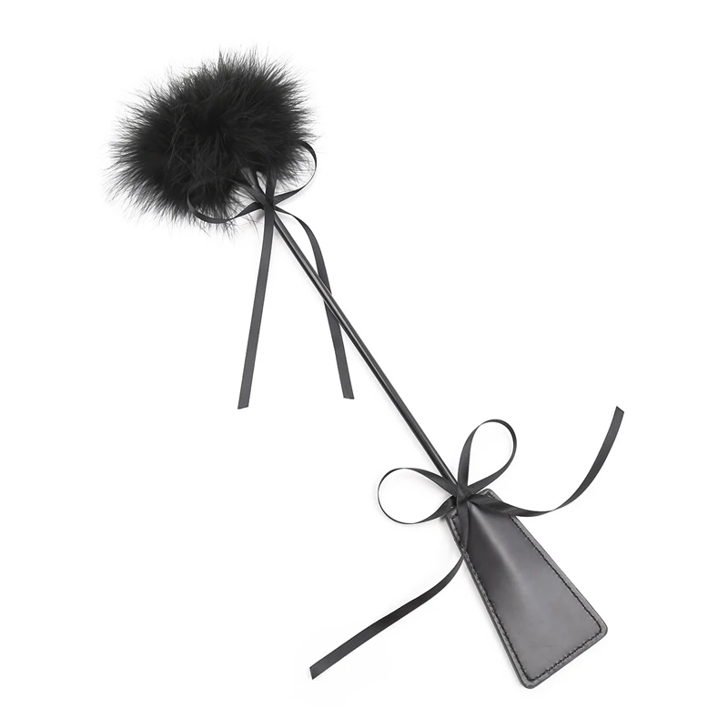 Black PU leather BDSM whip with a soft flirting feather end and an ergonomic handle for couples bondage play.