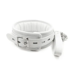 Close-up of a white leather BDSM collar with iron chain links and soft sponge interior on a neutral background.