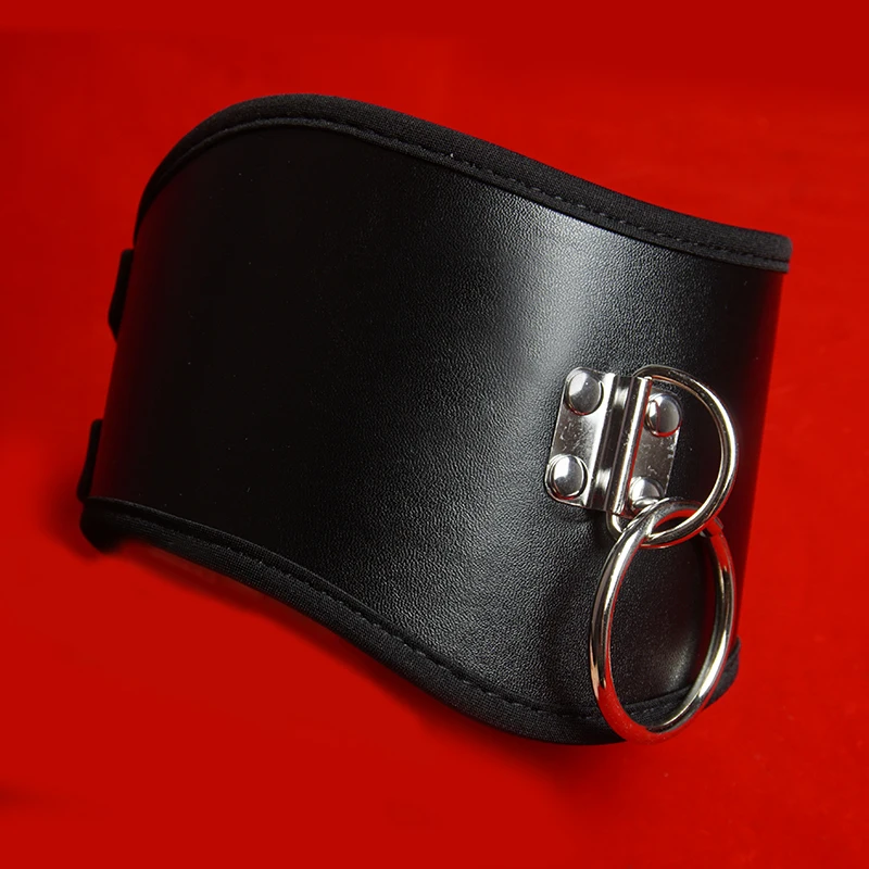 Close-up of a high-quality black leather posture BDSM collar with silver metal buckle and D-ring.