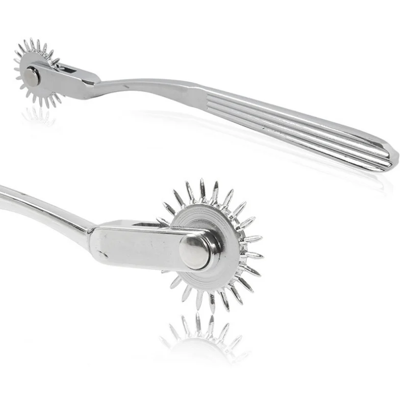 Close-up of a professional stainless steel gear roller massage tool for SM role-play.