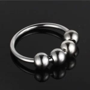 Stainless steel glan stimulating penis ring for men by Xlucia on a white background.