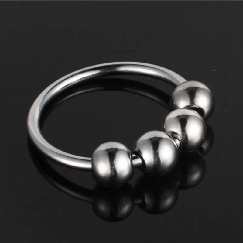 Stainless steel glan stimulating penis ring for men by Xlucia on a white background.