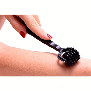 A high-quality BDSM sensory stimulation roller with a spiked wheel and ergonomic handle for adult couple games.
