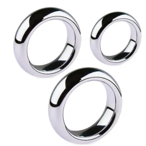A set of six silver-toned metal cock rings in various sizes arranged on a clean background.