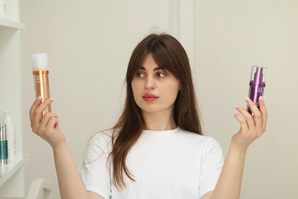 Woman comparing two personal care product bottles, evaluating ingredients and labels